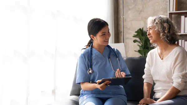 Doctor consults with an older patient